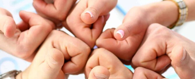 group of business people’s hands gathered together with thumbs up|group of business people’s hands gathered together with thumbs up|group of business people’s hands gathered together with thumbs up